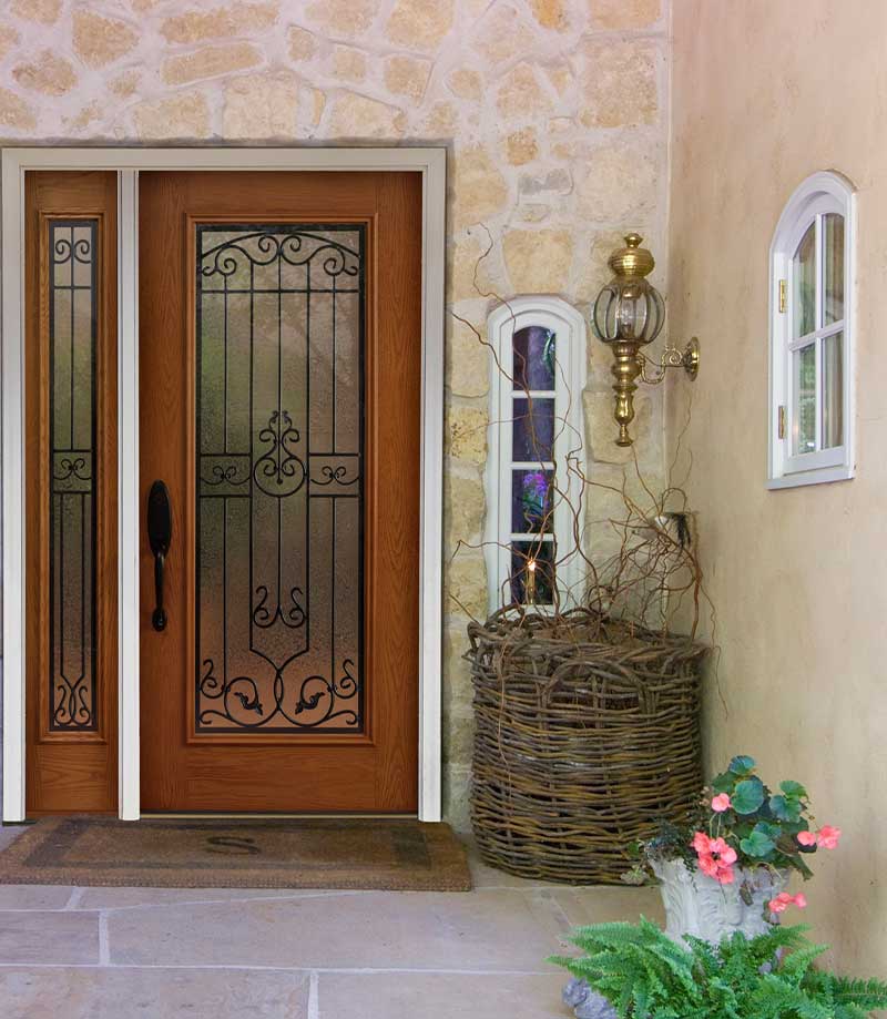 Front door, wood, glass and iron, curved windows at entryway