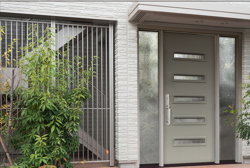 Grey front entry door with obscure glass inserts and side panels