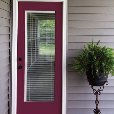 Red front entry door with large glass panel in the center