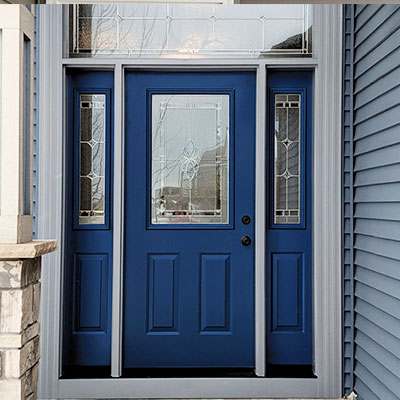 Blue front entry door with stained glass detail