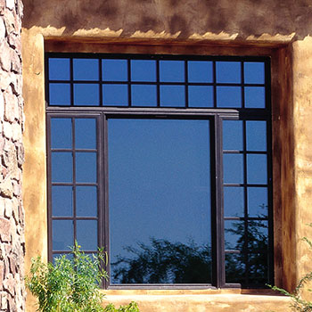 Large window with many panes in the front of a house