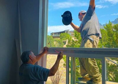 Men installing a large picture window