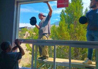 Men installing a large picture window